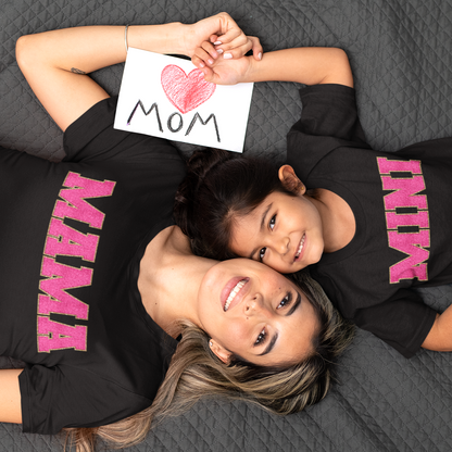 Mother and Daughter wearing matching black t-shirts with the words Mama and Mini in faux chenille glitter patches.